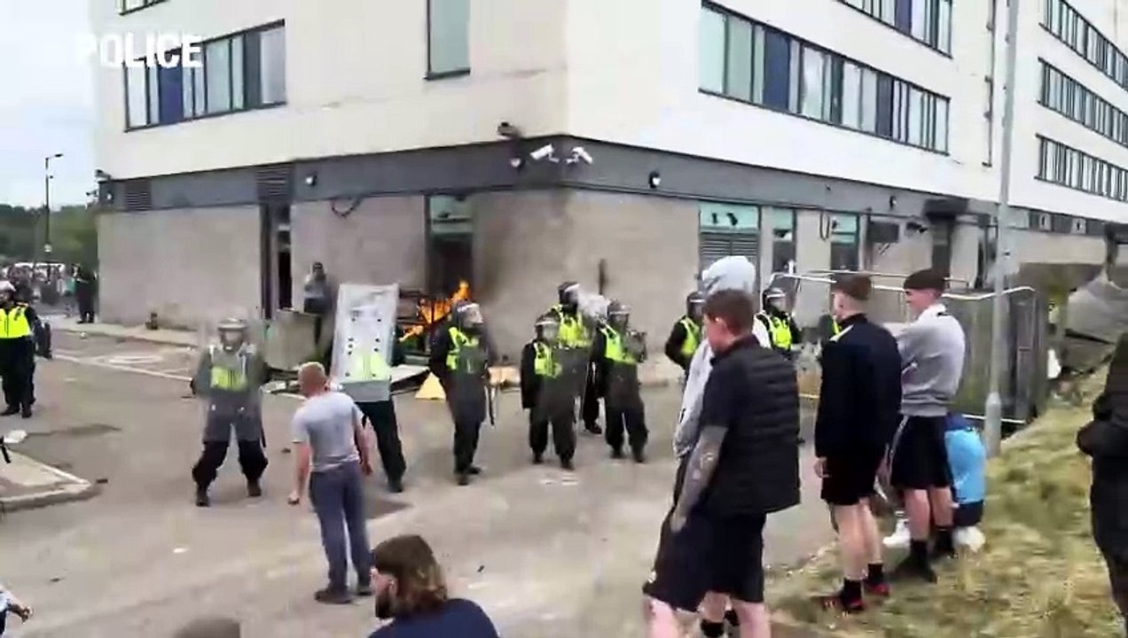 Thug takes two-year-old son to Rotherham race riot