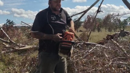 Stubborn chainsaw finally starts after guy uses the 'Australian Way' to get it working