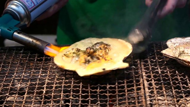 Sizzling Grilled Shellfish with Cheese: A Taste of Japanese Street Food Delights!