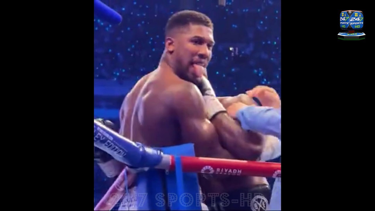 New footage shows Anthony Joshua appearing to taunt a fan just SECONDS before he was knocked out by Daniel Dubois - but his trainer reveals reason behind the gesture