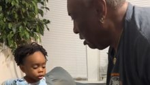 Woman films hilarious back-and-forth battle between her dad and toddler son