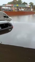 Firefighters film cars in flooded street in Dunstable