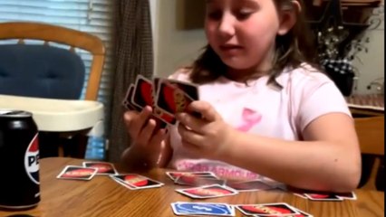 Young girl bursts into tears after realizing she lost ground in the UNO game