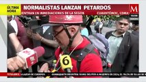 Normalistas de Ayotzinapa lanzan petardos a Segob durante protestas por los 43