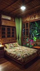 Bedroom serene oasis as raindrops create a soothing melody outside, while a vibrant floral bedsheet bursts with color inside.