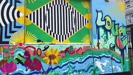 Artwork by Guerilla Joe, Seema Gill and Richard Heley on the front of the old Alpha Cafe building in St Leonards, East Sussex
