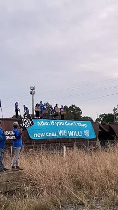 Climate protesters halt coal train at Sandgate, shovel out coal | Newcastle Herald, September 25, 2024