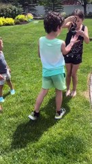 Fearless girl grabs a garden snake out of the bushes!