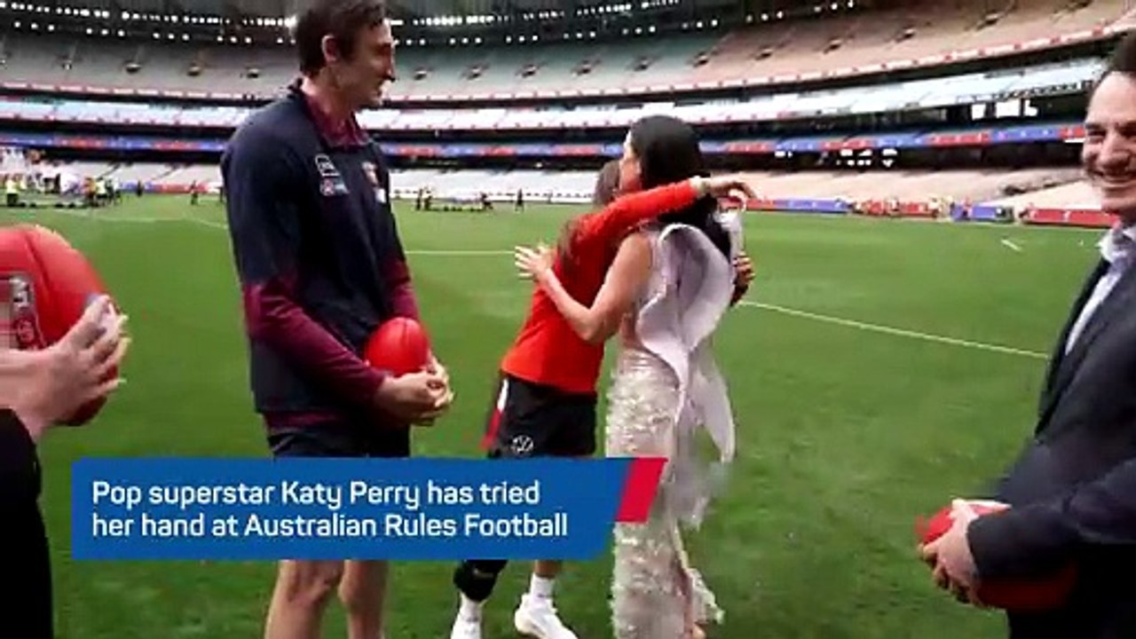 Roar talent: Katy Perry tests her Aussie Rules skills ahead of AFL Grand Final performance
