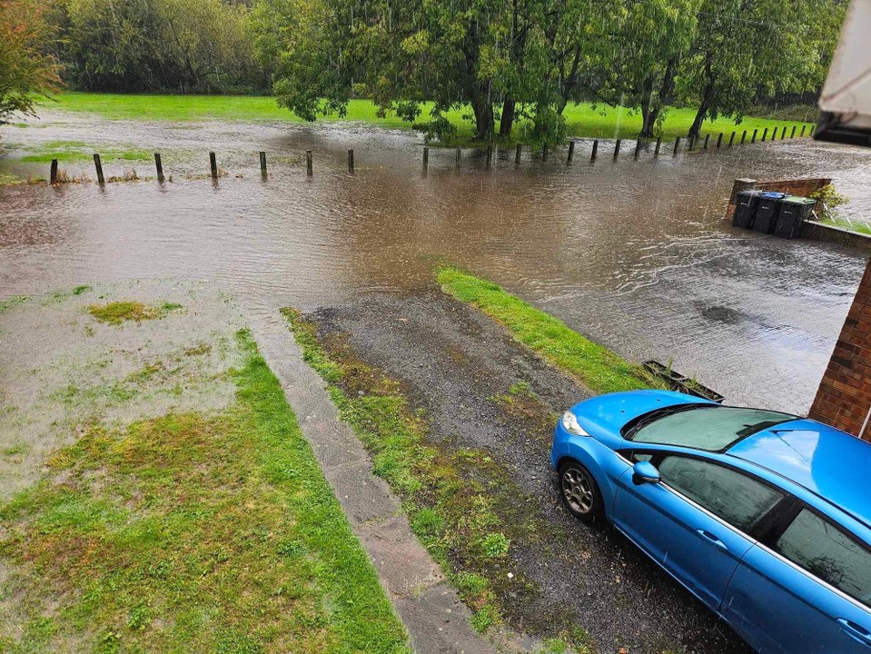 Cars driving through flood water on Mill Lane, near the Rea Valley cycle route