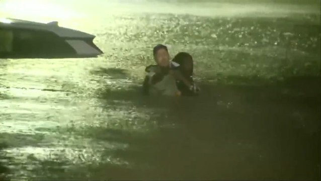 Moment weather reporter rescues woman from Hurricane Helene floods during live report