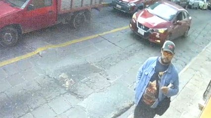 Biker's helmet holder snags on car door, leading to unexpected fall