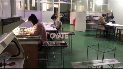 Workers are making infrared heating tubes ruby quartz heating lamps