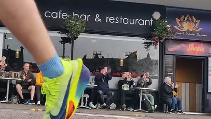 Loch Ness Marathon spectators outside River Grill cafe bar & restaurant