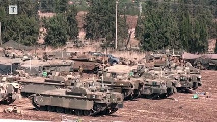 Israeli tanks prepare for invasion at Lebanon's border