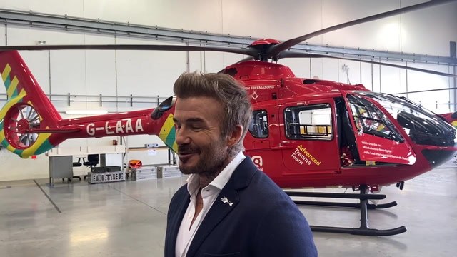 David Beckham views new Air Ambulance helicopters with Prince of Wales