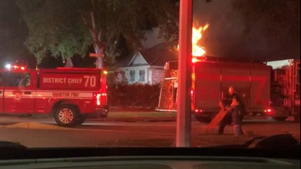Woman risks her own safety to rescue neighbor's dog from burning house