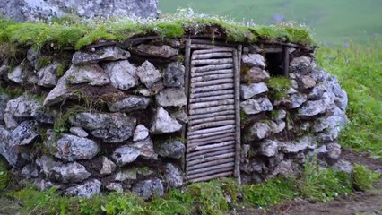 Building Bushcraft Stone Shelter in the Mountain with Grass Roof & Cozy Fireplace