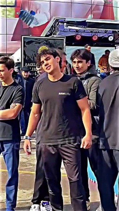 A young boy was seen working out vigorously in public.