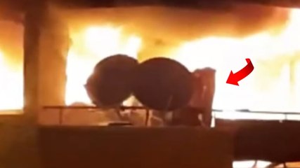 Yangında balkona kaçan kadın çarşafla korunmaya çalıştı