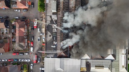 Drone video reveals smoke billowing across city centre after a huge fire broke out