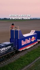 RIDING A BIKE A MOVING TRAIN