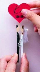 Bride and groom's wedding kiss table centerpiece