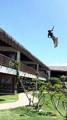 Person jumps from the balcony and starts kitesurfing in the swimming pool!
