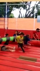 Kids are getting knocked down by the spinning arm on an inflatable!