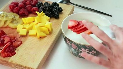 preparing-a-bowl-with-yogurt-and-fruit