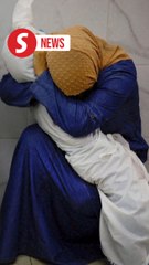 A picture of her grief gripped the world. A year on, Gaza woman haunted by memories