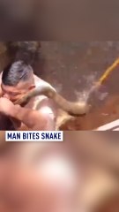 Man bites snake