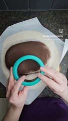 Sourdough loaf is being dusted with cocoa powder and scored before baking!