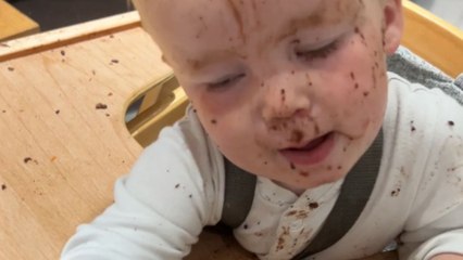Little girl tries chocolate cake for the first time and dislikes its taste