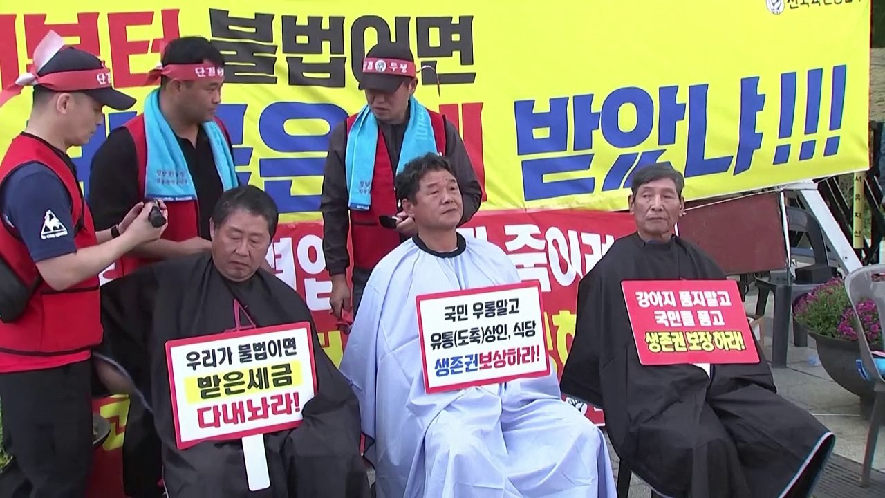 South Korean dog meat farmers shave heads to protest consumption ban