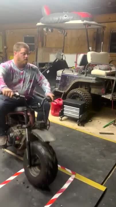 Man Tips Over While Loading Mini Bike on Truck