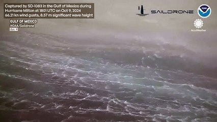 Скачать видео: Drone captures incredible video of giant waves inside Hurricane Milton