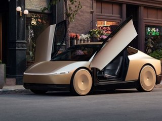 Elon Musk lässt sich vom neuen Robotaxi chauffieren