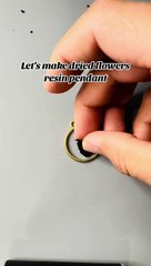 Artist shows the process of making a dried flower and resin pendant!