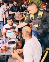 Man Detained for Wearing Palestine Flag