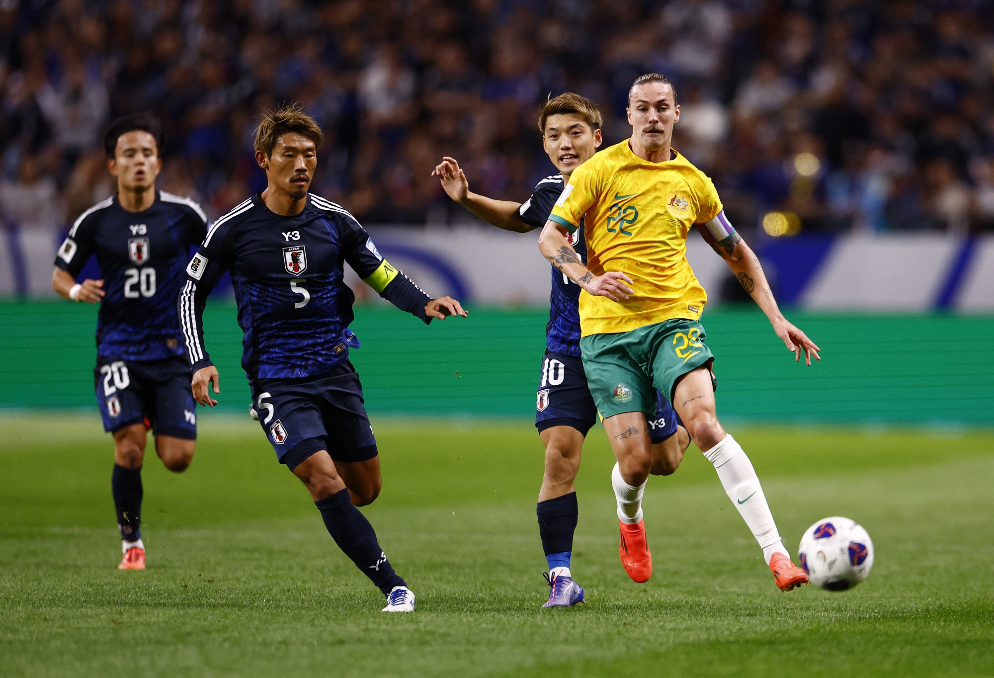 Socceroos park the bus in gutsy draw with Japan