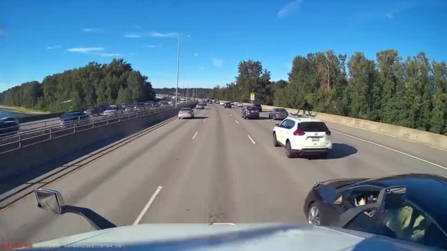 Car Crashes Into Semi-Truck While Overtaking it