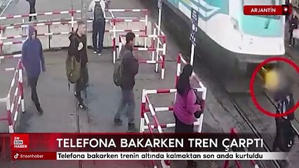 Arjantin'de telefona bakarken trenin altında kalmaktan son anda kurtuldu