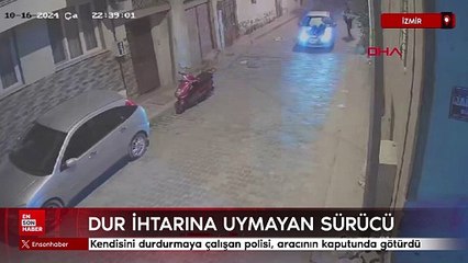 İzmir'de kendisini durdurmaya çalışan polisi, aracının kaputunda götürdü