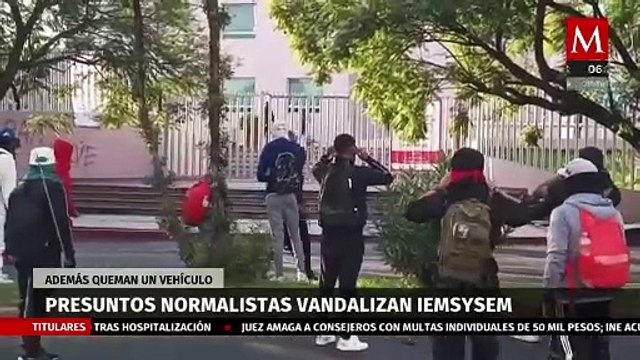Presuntos normalistas vandalizan oficinas del IEMSySEM y queman un vehículo en Michoacán