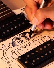 This artist changed the look of the guitar entirely with doodles all over!