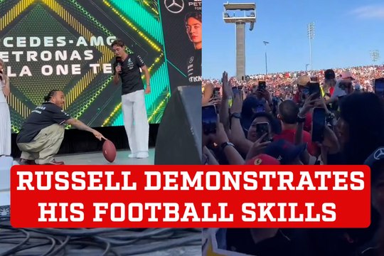 George Russell shows off his football kicking skills with the help of Lewis Hamilton