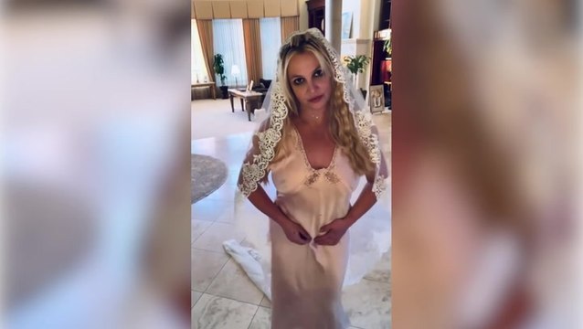 Britney Spears declares she is married again as she dons wedding dress and veil
