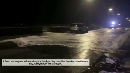 Dramatic scenes as waves breach Borth high street during storm Ashley