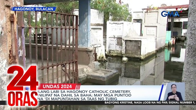Ilang labi sa Hagonoy Catholic Cemetery, inilipat na dahil sa baha; may mga puntod na 'di mapuntahan sa taas ng tubig | 24 Oras